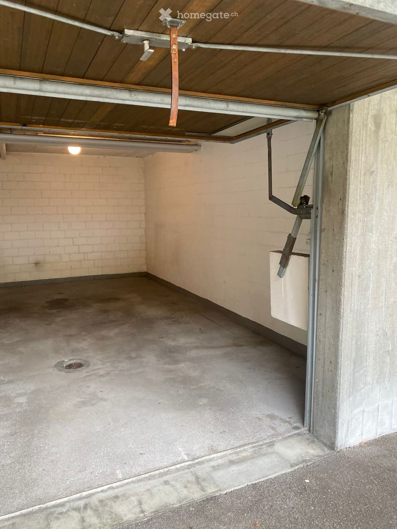 {"visible_features": ["Garage"], "type": "Garage", "objects": [], "description": "Empty underground garage with concrete floor, brick wall, and metal garage door mechanism.", "localized_descriptions": {"EN": "Empty underground garage with concrete floor,