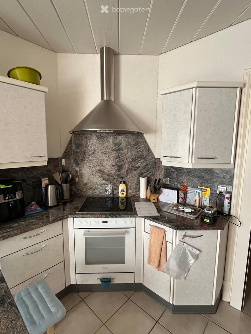 {"type": "Kitchen", "objects": ["oven", "induction stove", "coffee maker", "cupboard", "faucet", "towel", "oven hood", "cupboard", "cupboard", "cupboard", "cupboard", "cupboard", "cupboard", "cupboard", "cupboard", "cupboard", "cupboard", "cupboard", "cup