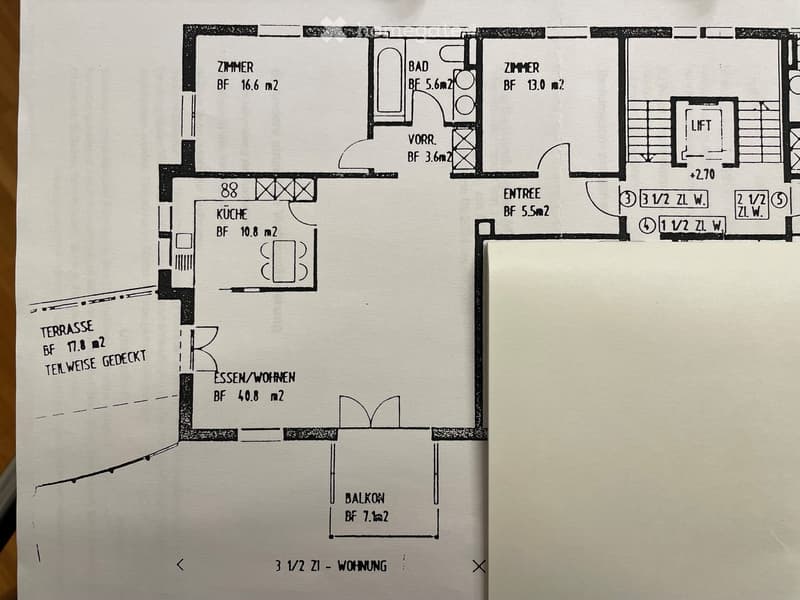 Floor plan of a 3.5-room apartment with living/dining area, kitchen, two bedrooms, bathroom, hallway, entrance, and balcony.