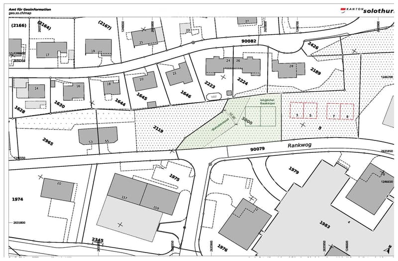 Floor plan showing multiple plots and buildings with numbered sections and boundaries.