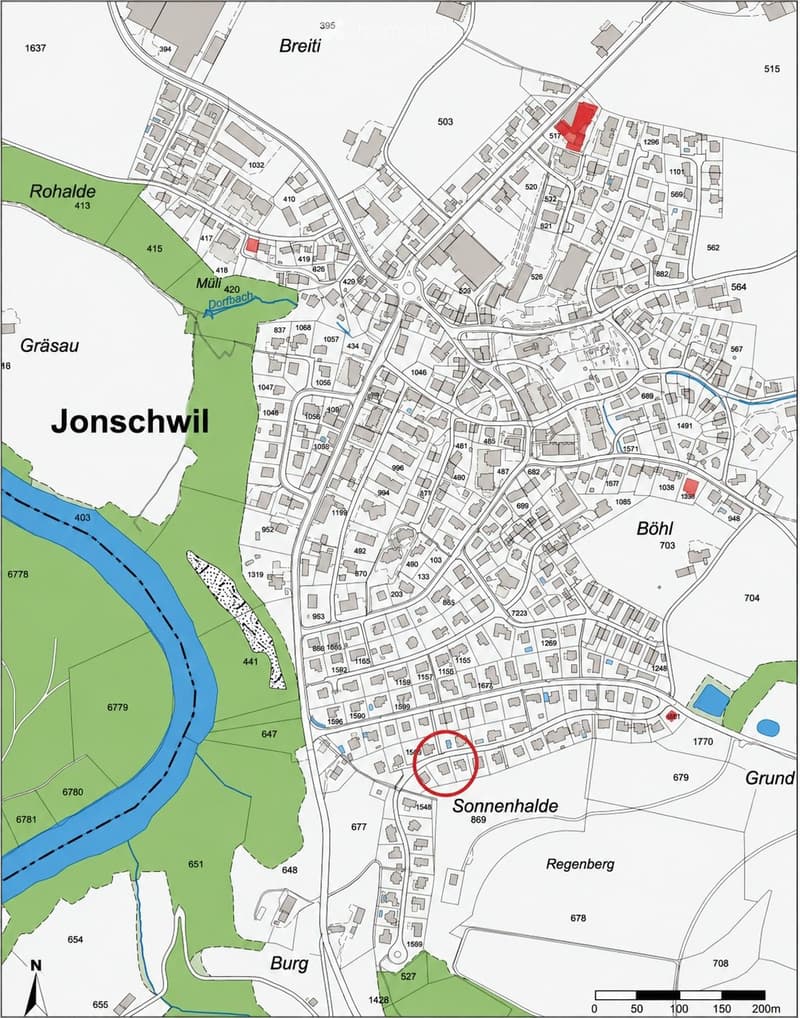 A detailed map of the Jonschwil area, showing streets, buildings, and geographical features including rivers and green spaces.