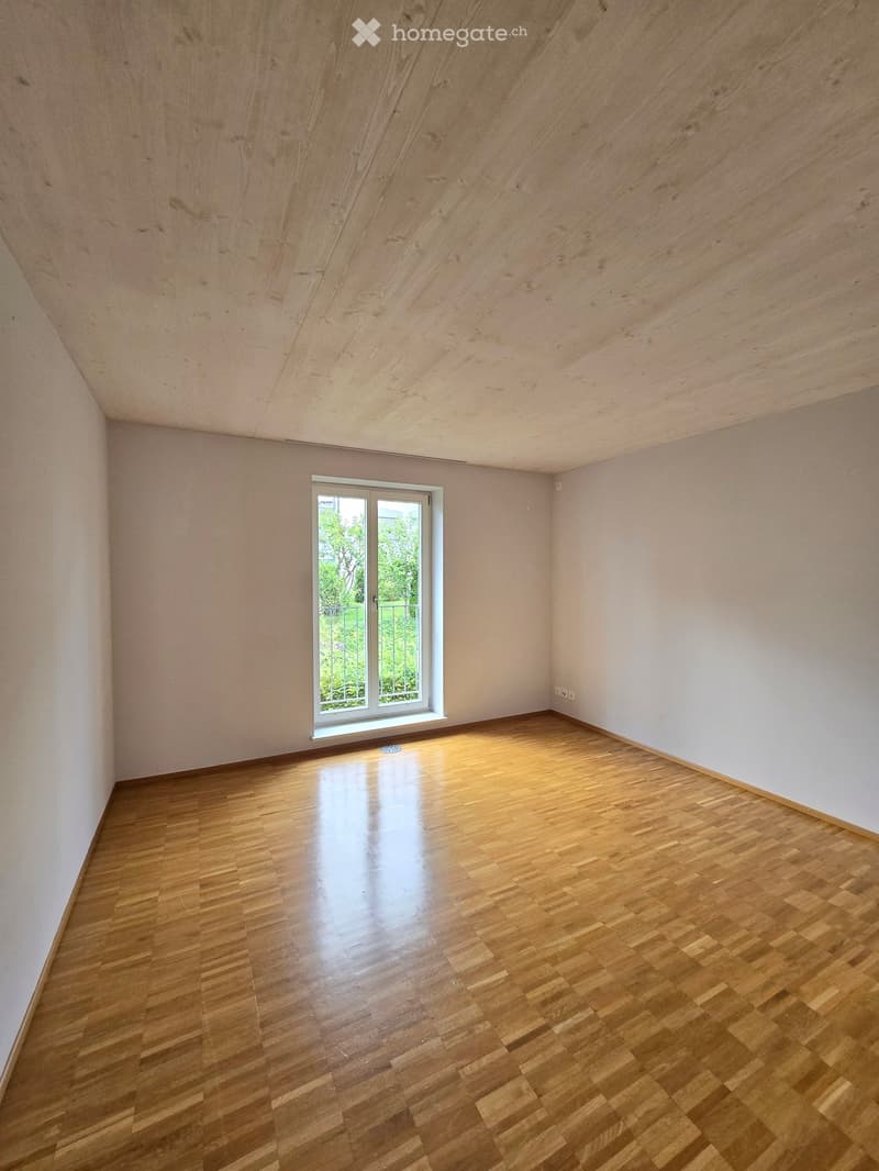 wooden floor, white walls, large window with balcony, empty room