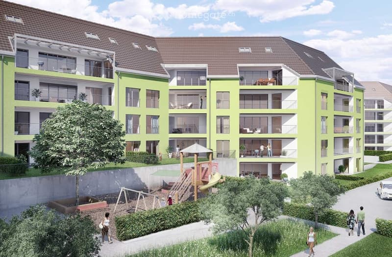 Modern multi-story residential building with green facade, balconies, and surrounding greenery. Includes playground area with slides and swings.