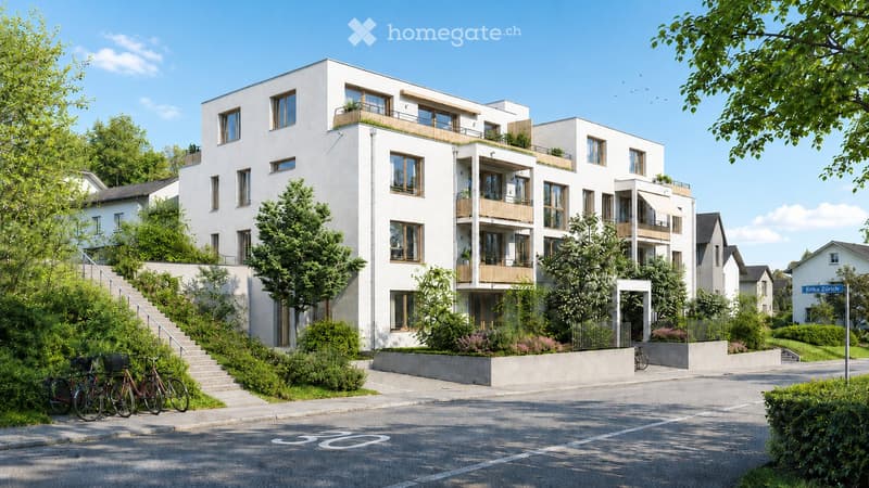 Modern multi-story residential building with white facade, large windows, balconies, and greenery around the base.
