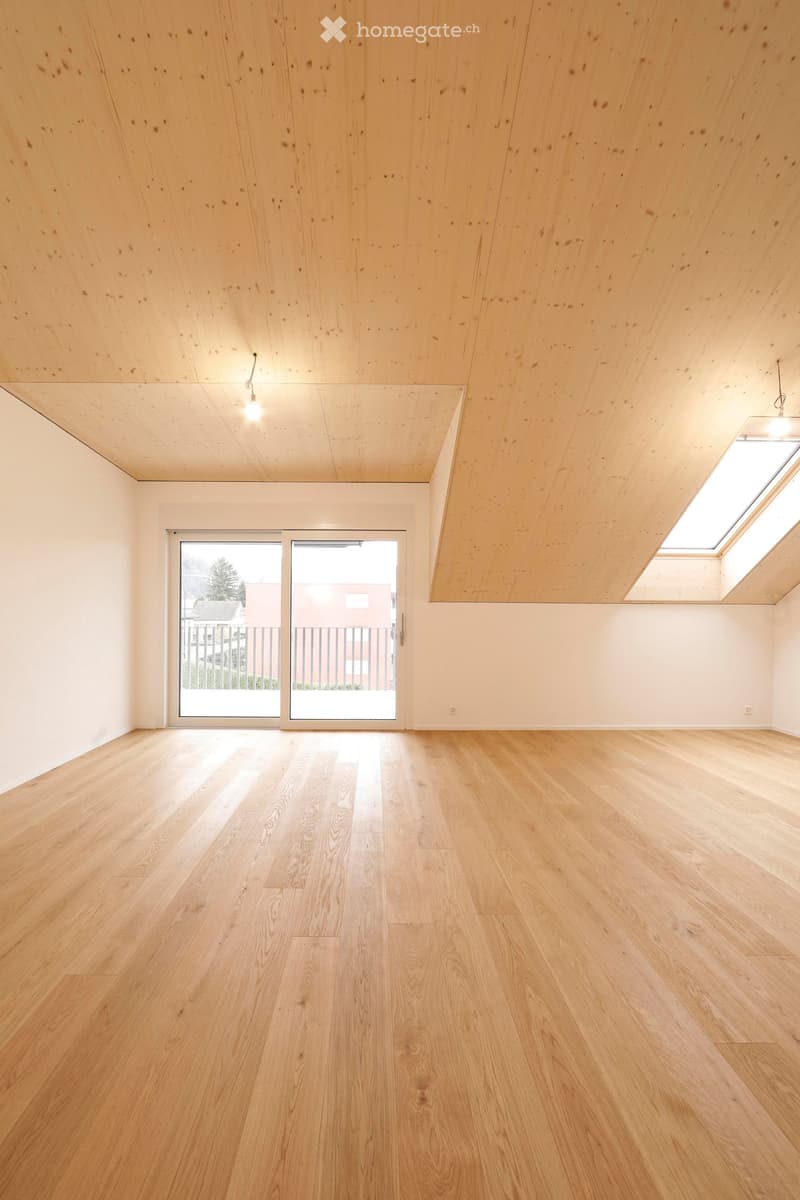 Empty room with wooden floor, sliding glass door, glass windows, wooden ceiling, balcony