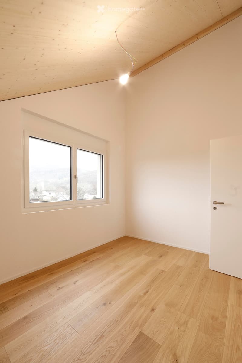 light wood floor, white walls, window, raised ground floor, nice outside view