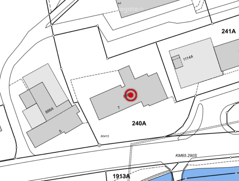 Floor plan showing multiple lots and buildings, with lot numbers and boundaries marked. A red circle highlights a specific location.