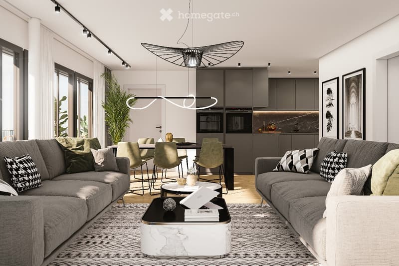 Modern living room with grey sofas, coffee table, dining area with chairs and table, pendant lights, and framed pictures on the wall.