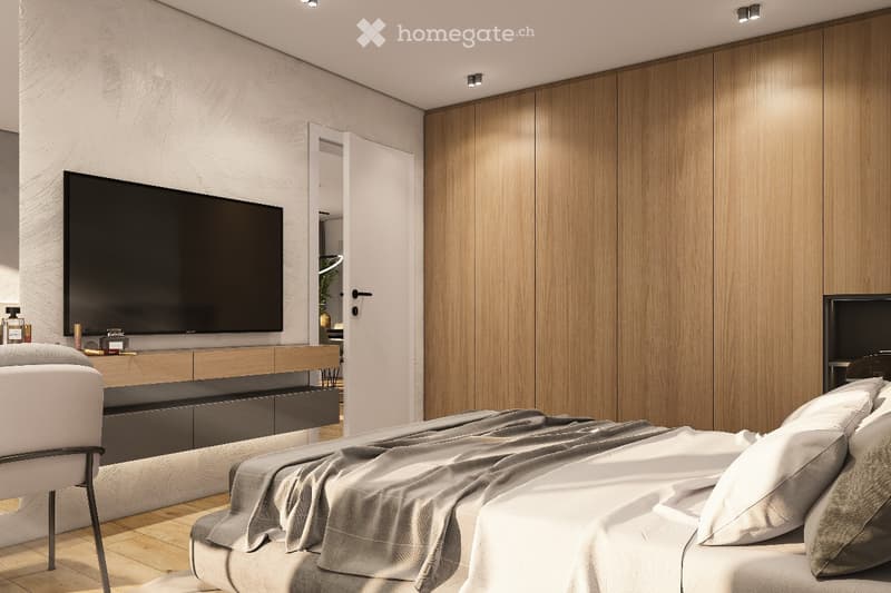 Modern bedroom with a large bed, a sleek TV mounted on the wall, a wooden cabinet, a chair, and a small table with decorative items.