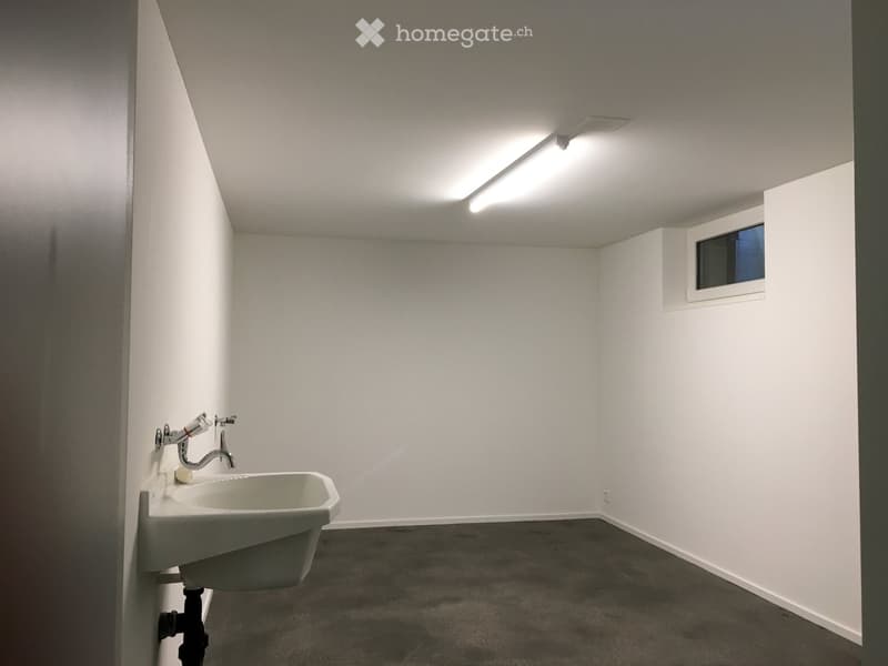 empty room, white walls, white sink, white floor, small window