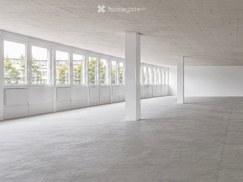 Completely empty room with bare walls and polished concrete floor. No furniture or equipment.