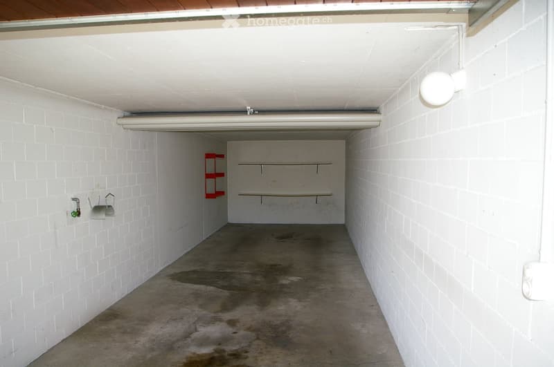 {"visible_features": ["Garage"], "type": "Garage", "objects": [], "description": "Empty garage with white brick walls, concrete floor, and minimal storage shelves.", "localized_descriptions": {"EN": "Empty garage with white brick walls, concrete floor, an