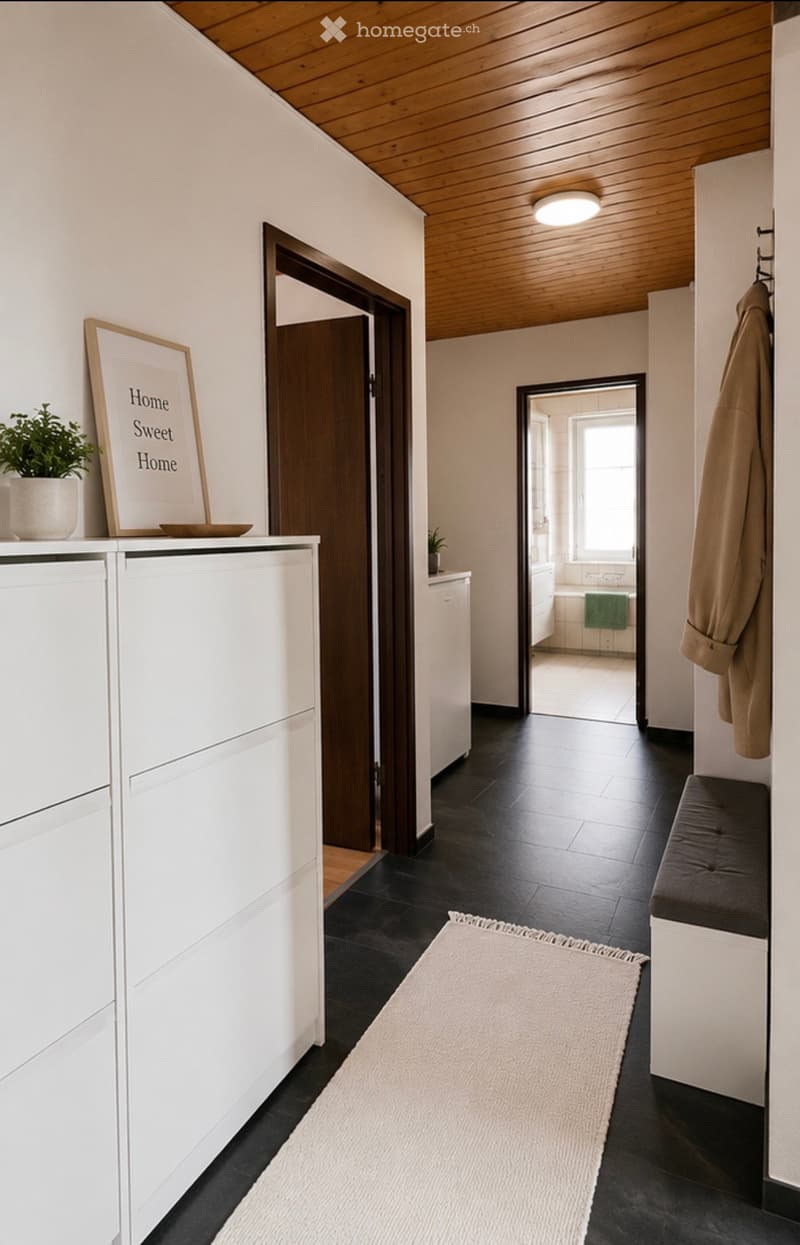 Modern hallway with dark tiled floor, white walls, wooden ceiling, coat rack, bench, and a small plant on a shelf.