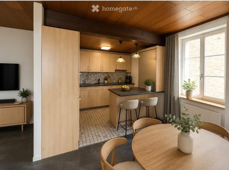 Modern kitchen with light wooden cabinets, a central island with bar stools, a dining area with a round table and chairs, and various appliances and decor including potted plants and a television.