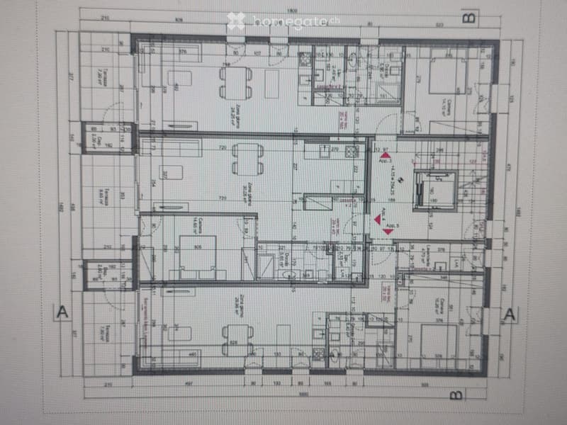 Floor plan of a multi-room residential space with labeled rooms and dimensions, including living room, dining area, bedrooms, bathrooms, and kitchen.