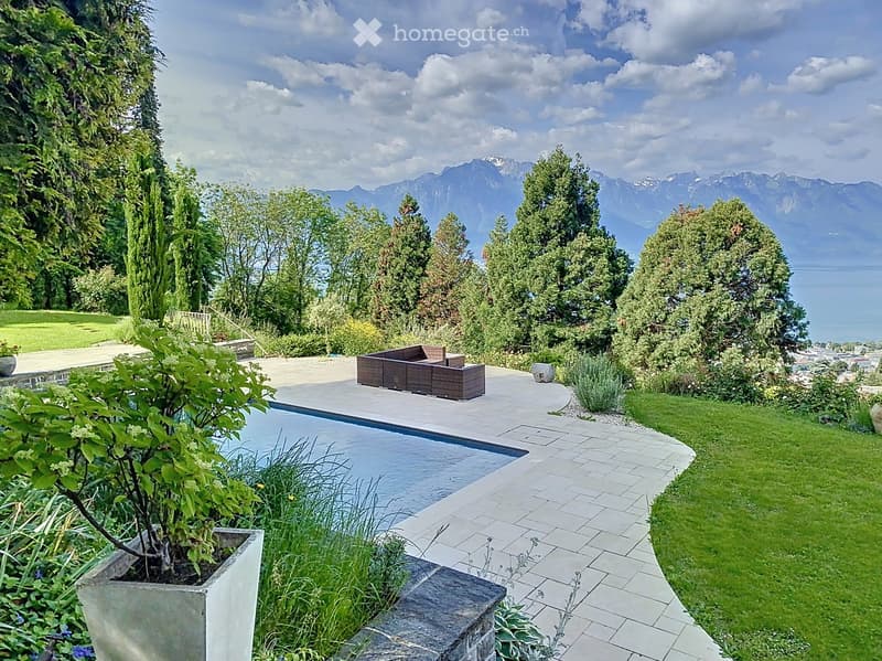 large garden with trees, swimming pool, outdoor seating, lake view