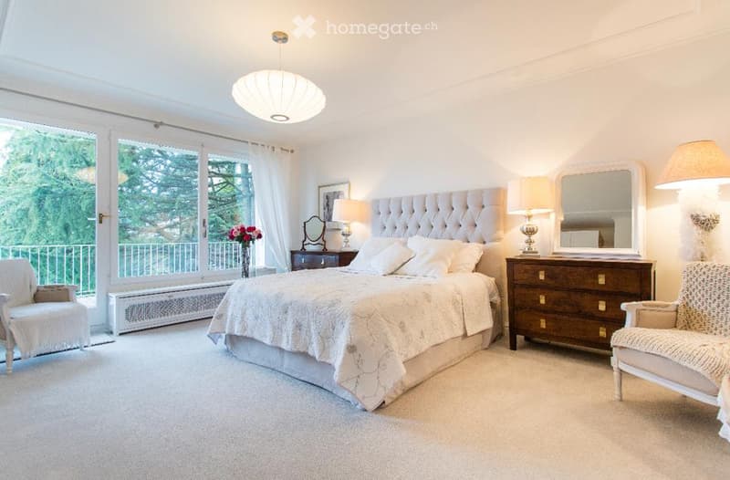 master bedroom, double bed, white carpet, white walls, wooden headboard, lamps, mirror, furniture, balcony, outdoor view