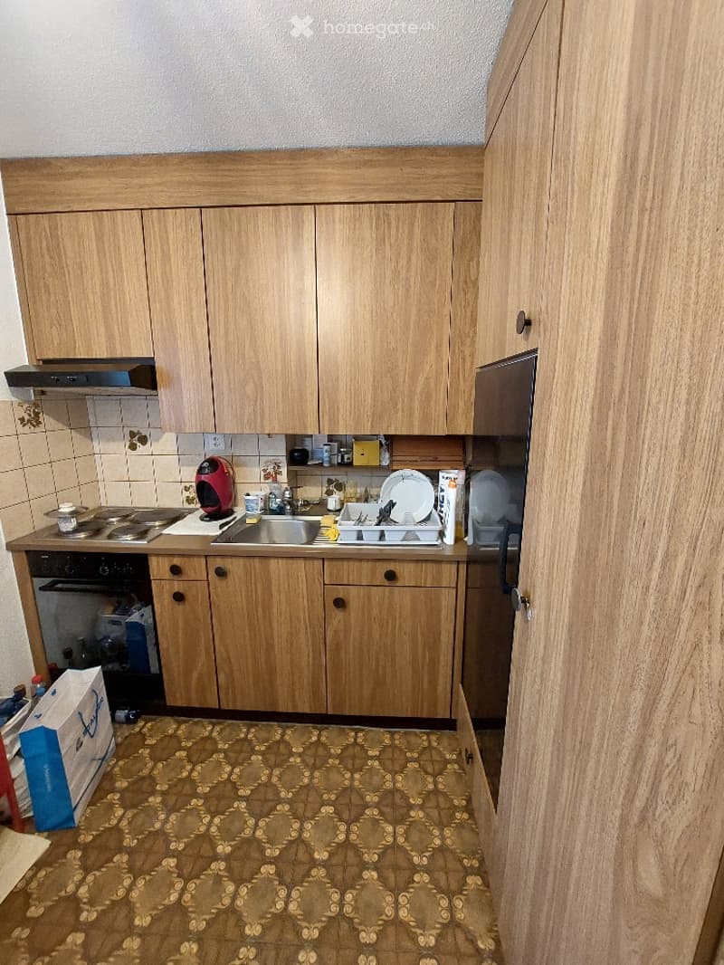 kitchen with wooden cabinets, sink, refrigerator, oven, gas stove, countertop, tile flooring