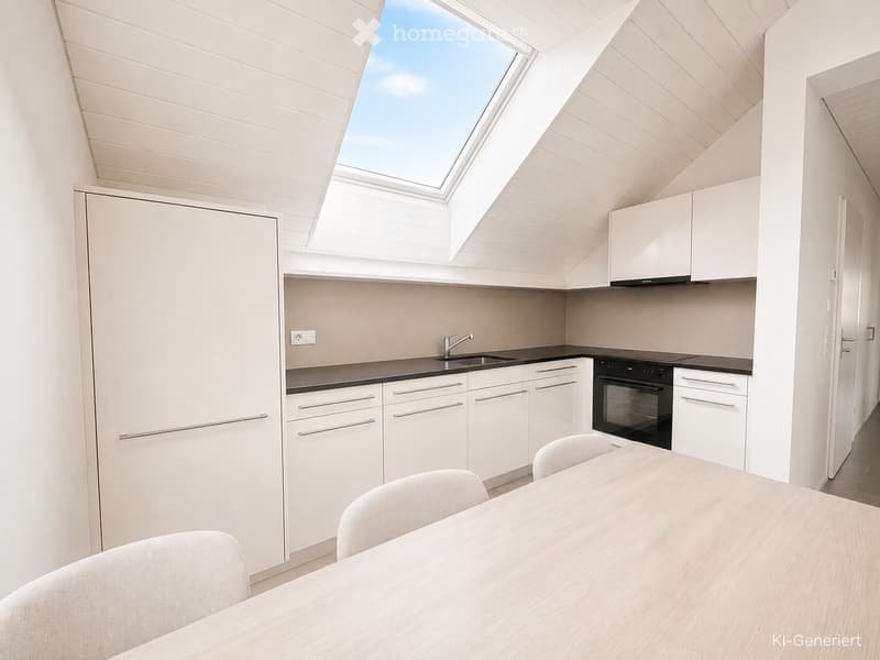 Modern kitchen with white cabinets, black countertops, a sink, an oven, and a dining area with a table and chairs.