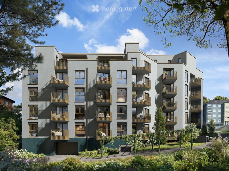 Modern multi-story apartment building with balconies, large windows, and a garage entrance.