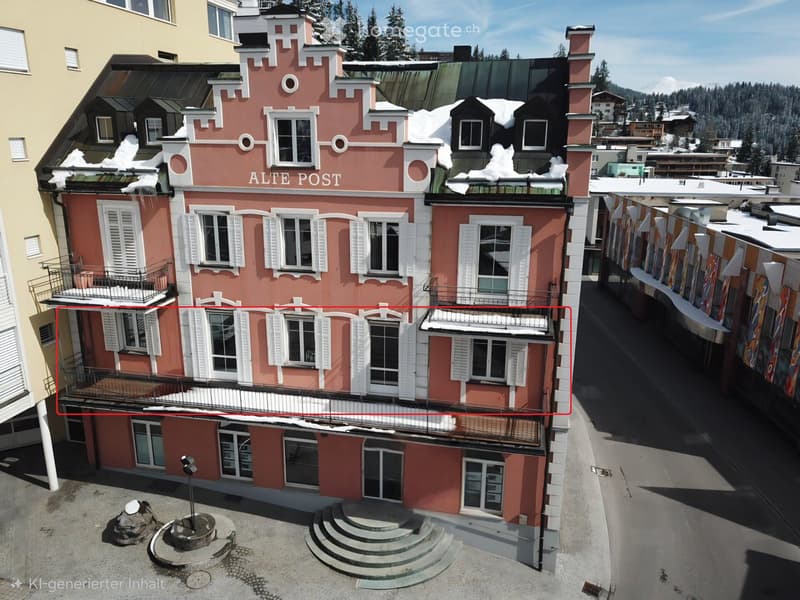 3 story building, pink exterior, white shutters, multiple balconies, snow on the roof