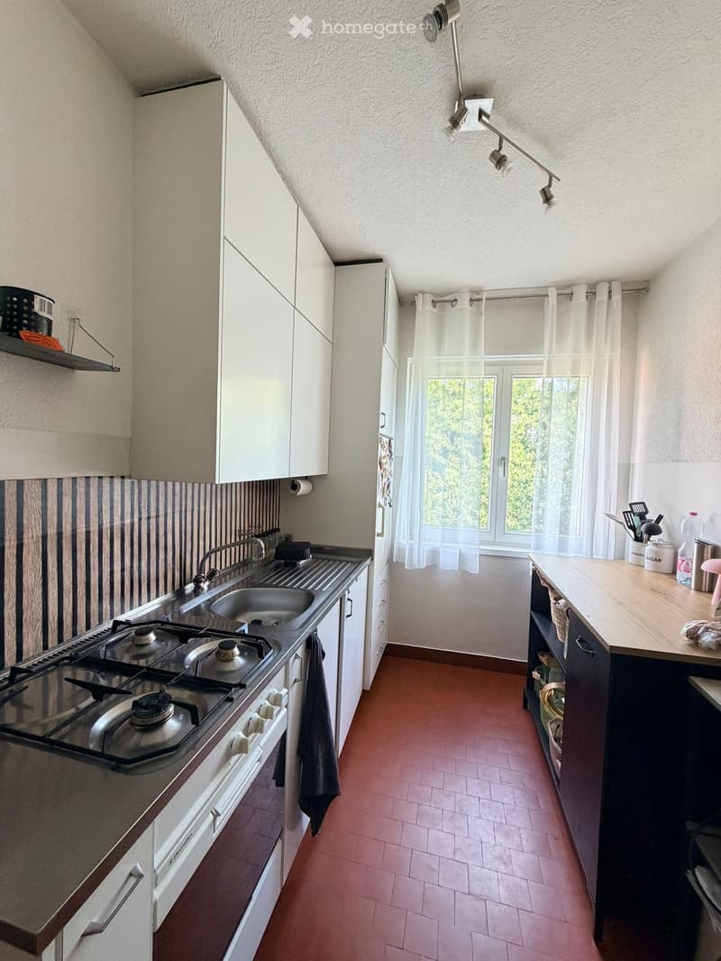 {"type": "Kitchen", "objects": ["stove", "sink", "faucet", "cabinets", "counter", "curtain", "light fixture", "toaster", "cupboard", "bottle", "faucet", "oven", "cupboard", "cupboard", "cupboard", "cupboard", "cupboard", "cupboard", "cupboard", "cupboard"