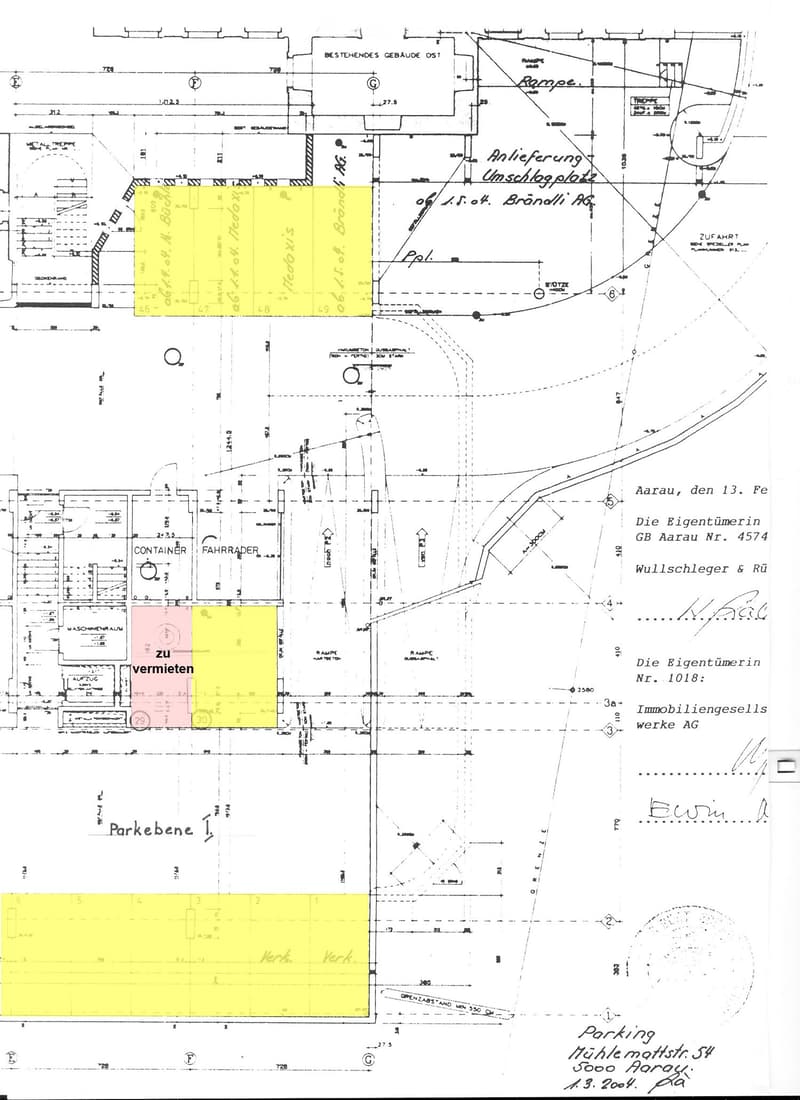 Floor plan of a property with labeled areas including parking, delivery area, and rental spaces. Includes dimensions, property boundaries, and surrounding structures.