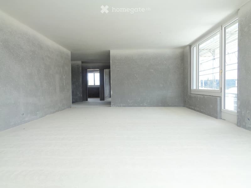 Empty room with bare concrete walls and floor, large windows, and a visible doorway leading to another space.