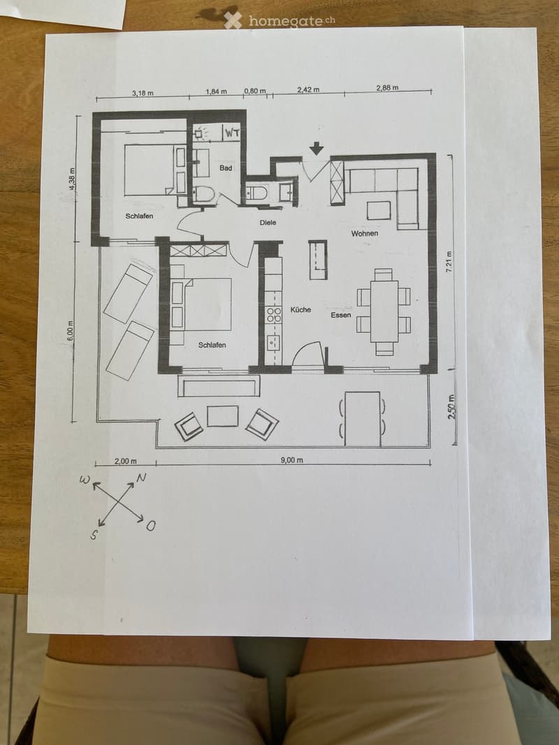 Floor plan of a 2-bedroom apartment with living, dining, kitchen, and bathroom areas. Includes dimensions and orientation markers.