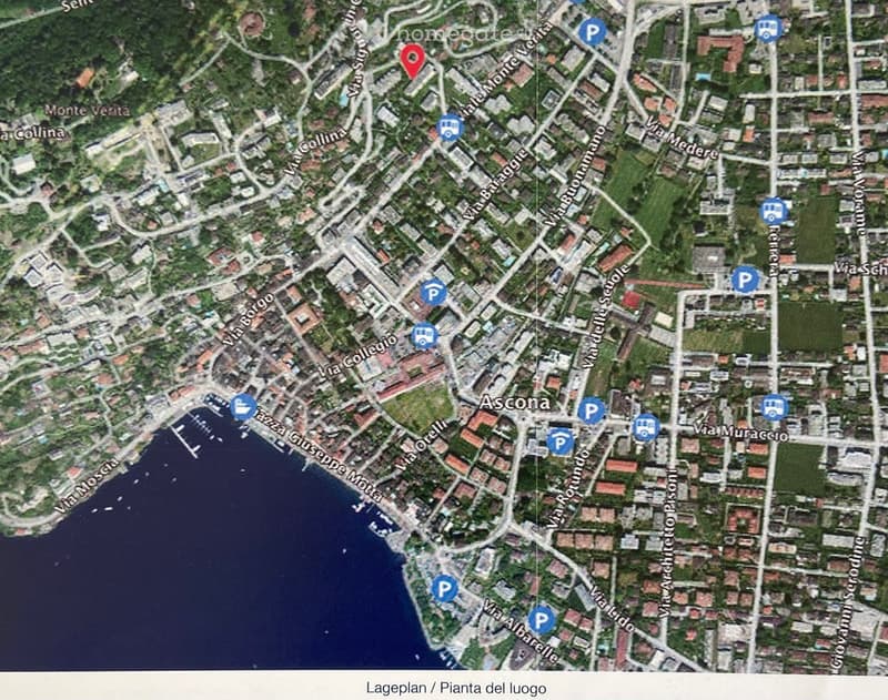 Satellite map showing the layout of Ascona, Switzerland, with streets, buildings, parking areas, and public transport stops.