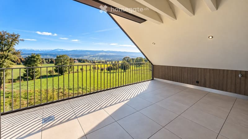 Balcony with tiled floor, wooden paneling, metal railing, and scenic countryside view.