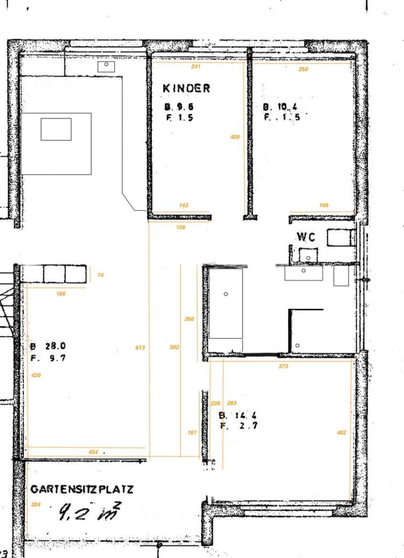Floor plan showing a layout with two bedrooms labeled "KINDER", a WC, a living area, and a garden seating area labeled "GARTENSITZPLATZ".