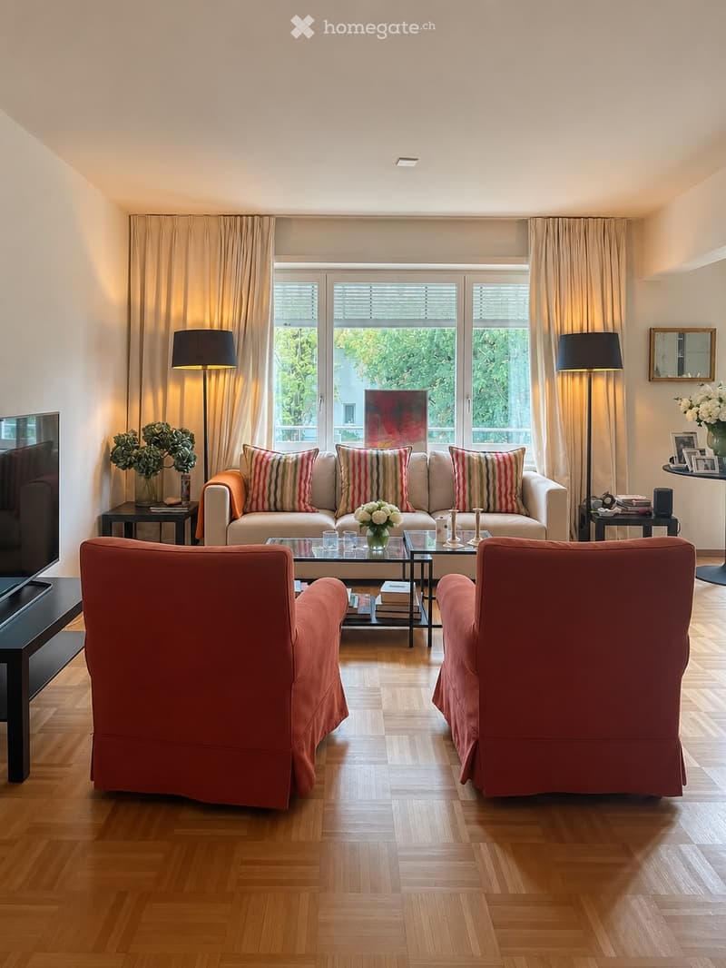 Modern living room with light-colored sofa, striped cushions, two armchairs, coffee table, side tables, floor lamps, and decorative vases.