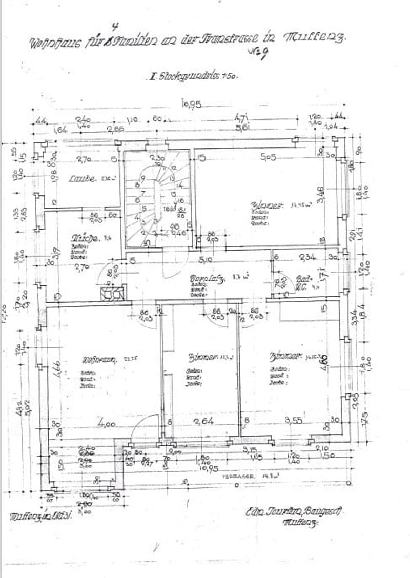 Floor plan of a residential building showing multiple rooms, including a kitchen, living room, bedrooms, and bathrooms, with dimensions and labels.