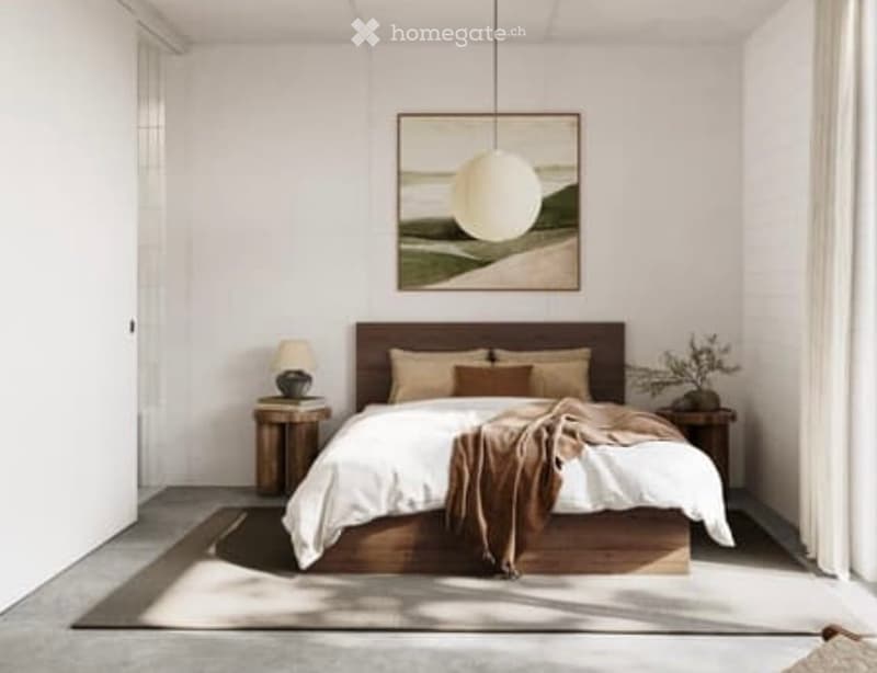 A modern, minimalist bedroom with a large wooden bed, white bedding, nightstands, a hanging pendant light, and a scenic picture on the wall.