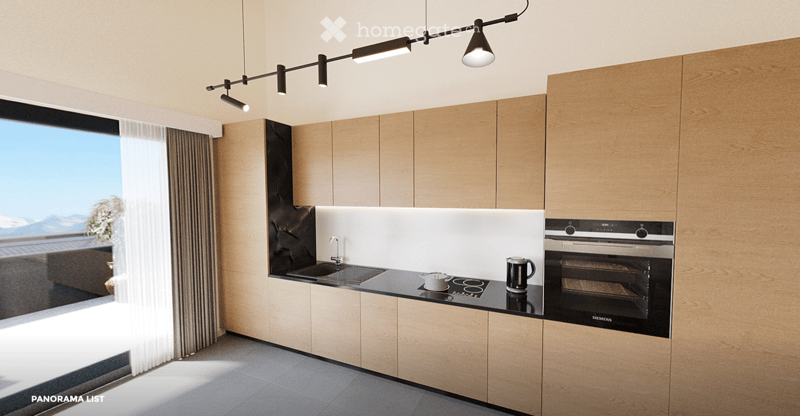 Modern kitchen with light wood cabinets, stainless steel appliances, and a sleek countertop. Features a built-in oven, sink, and a view of the outdoors.