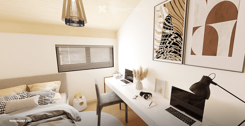 Modern, cozy room with a sofa, desk, and laptop. Features large windows with blinds, artwork on the walls, and a hanging pendant light.