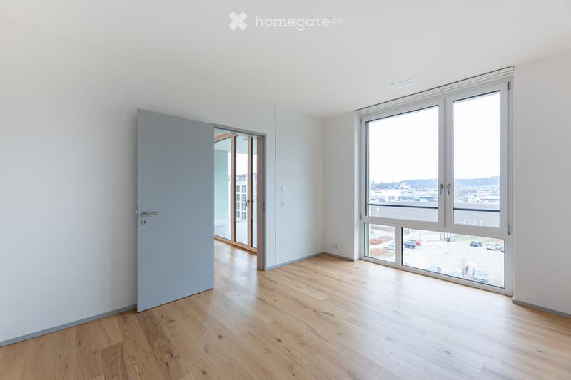 Open door, wooden floor, large window, balcony, modern minimalist design, white walls, parking lot view
