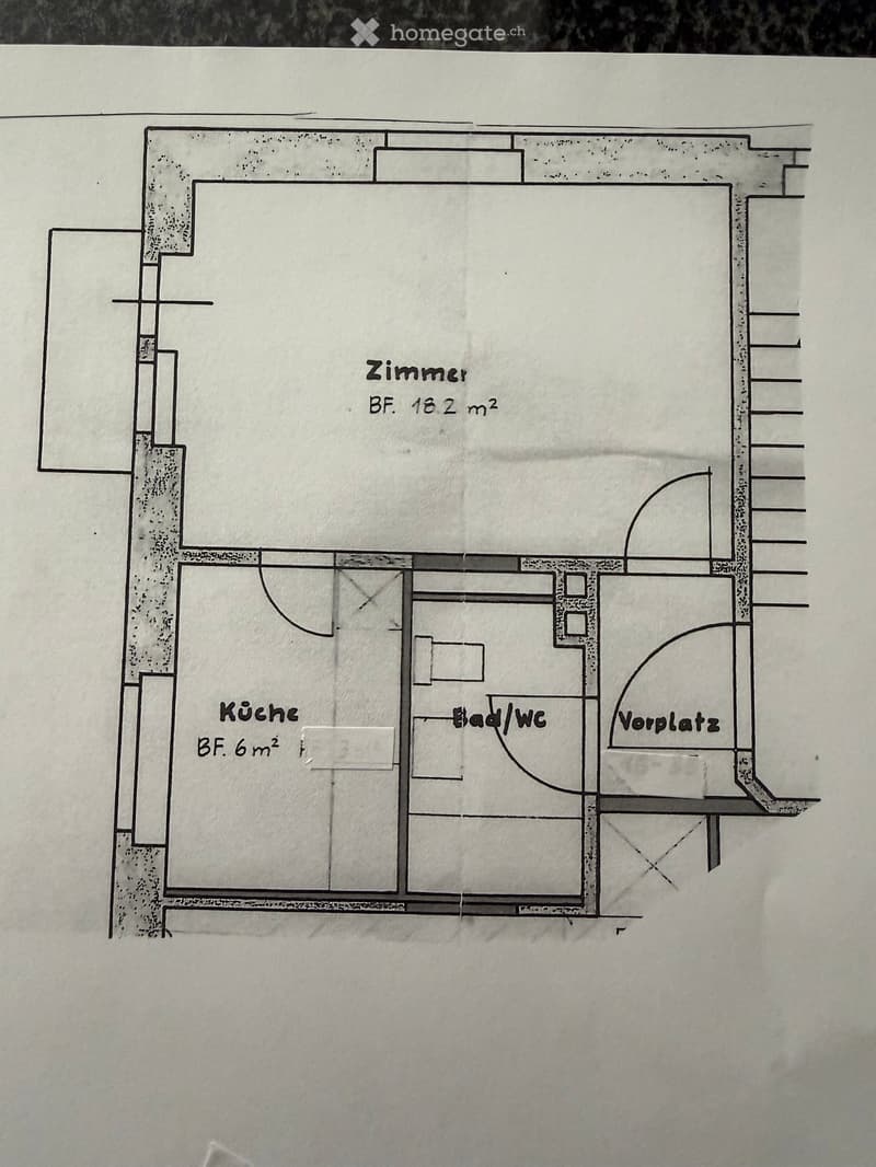 Floor plan showing a room (18.2 m²), kitchen (6 m²), bathroom/WC, and entrance area.