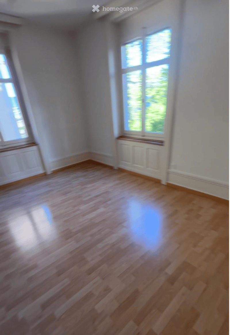 Completely empty room with bare walls and wooden floor. No furniture or equipment.