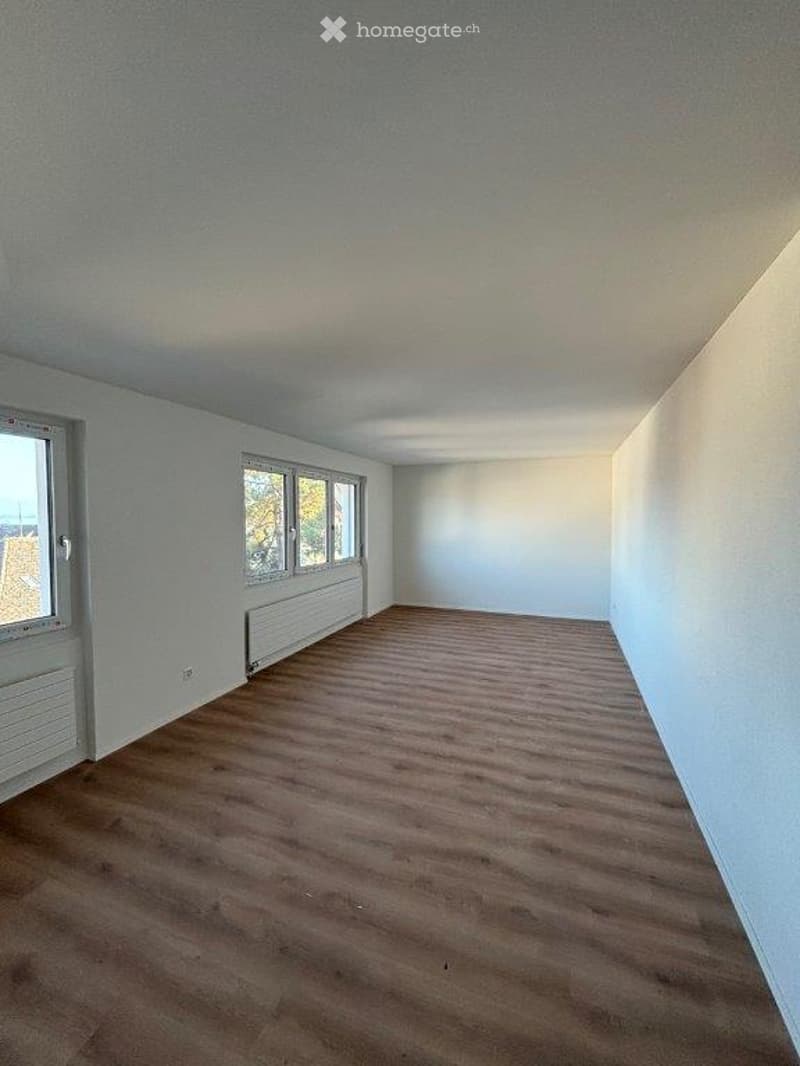 Completely empty room with bare walls and wooden floor. No furniture or equipment.