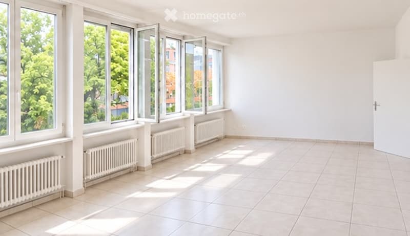 Empty room with large windows, white walls, tiled floor, radiators, and a door.