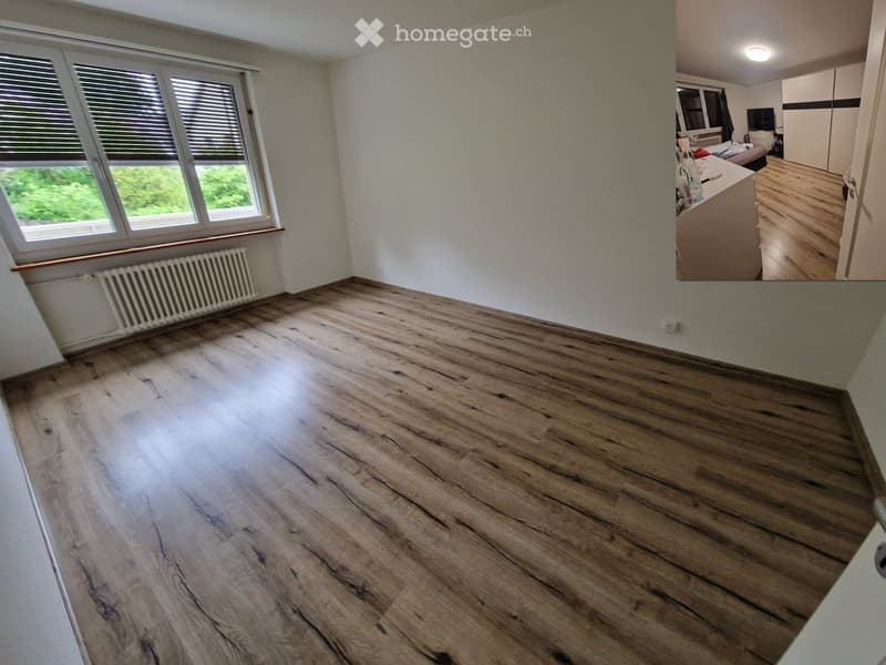Empty room with wooden flooring, white walls, and a window with blinds. No furniture or equipment is present.