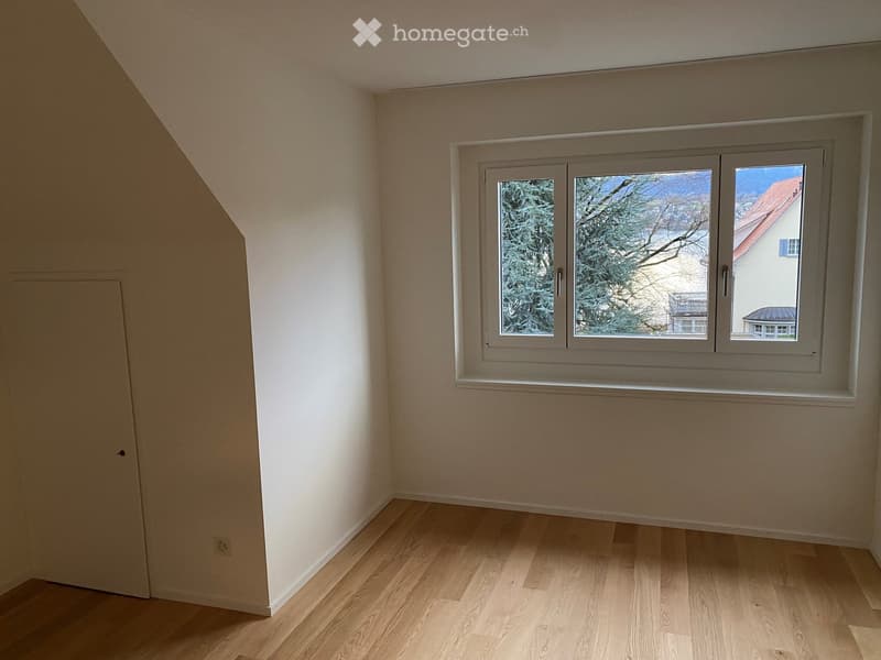empty room, wooden floor, white walls, window overlooking outside