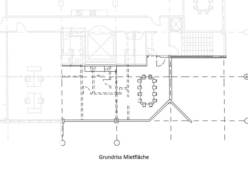 Floor plan of a commercial rental space showing multiple rooms, corridors, and a staircase. Layout includes offices, meeting rooms, and a reception area.