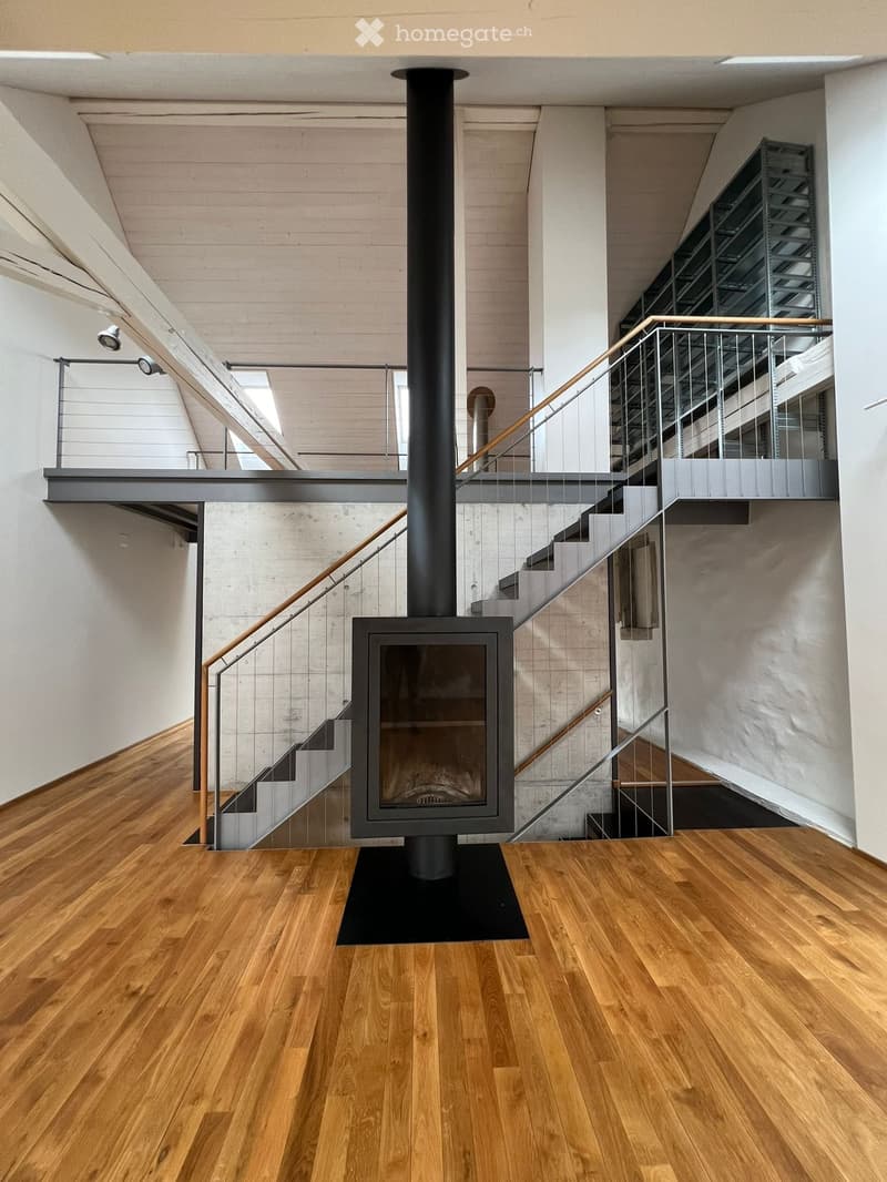 Wooden floors, fireplace, staircases, metal railings, glass windows, spotlights