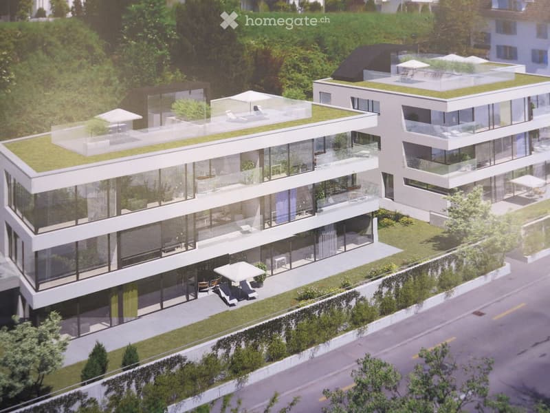 Modern multi-story residential building with large glass windows, green rooftop terraces, and outdoor seating areas.