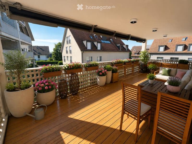 Wooden deck terrace with potted plants, a small sofa, and a table with chairs. The railing is decorated with additional planters, and the background shows neighboring houses.