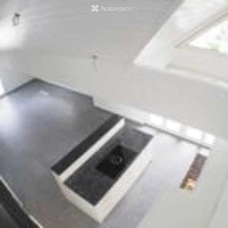 Completely empty room with a concrete floor and white walls. No furniture or equipment is present.
