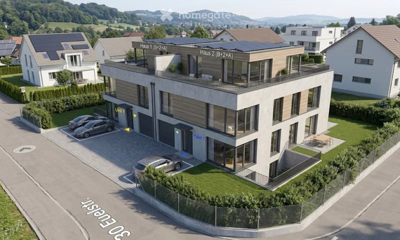 Modern two-story building with solar panels on the roof, labeled 'Haus 1' and 'Haus 2', featuring a garage and parking area.